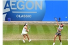 BIRMINGHAM, ENGLAND - JUNE 14: Caroline Garcia of France (L) and Shuai Zhang of China (R) in action against Casey Dellacqua and Ashleigh Barty of Australia on day six of the Aegon Classic at Edgbaston Priory Club on June 13, 2014 in Birmingham, England. (Photo by Tom Dulat/Getty Images)